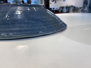 A Chinese monochrome blue Swatow dish with incised carp design, Ming